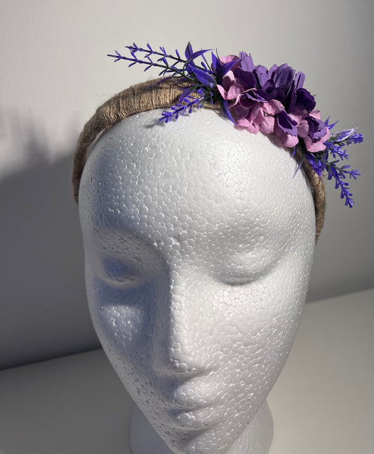 Handmade jute ribbon on plastic headband with flowers.