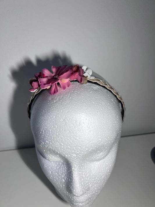 Handmade braided jute ribbon on plastic headband with flowers.