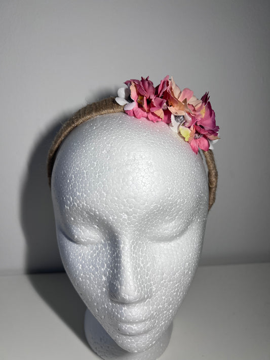 Handmade jute ribbon on plastic headband with flowers.